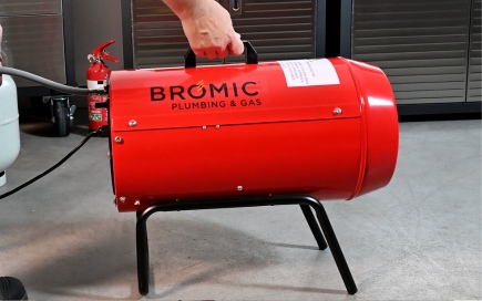 A red gas heater labeled 