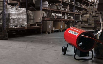 A red industrial heater labeled 