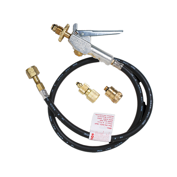 A brass valve connects to a black hose with metal fittings and a silver lever. The setup is accompanied by two brass adapters and a red warning tag.