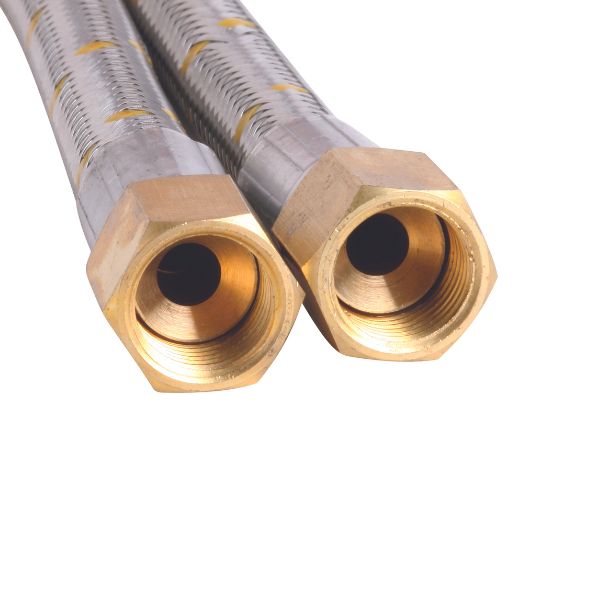Two metal hoses with brass hexagonal fittings are lying side by side, displaying hollow openings. They are situated against a plain white background.