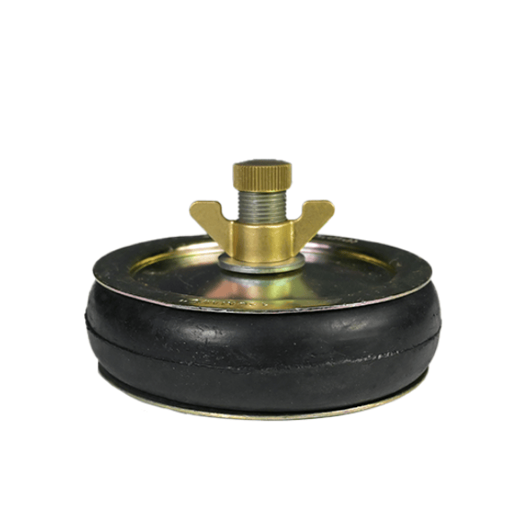 Brass and rubber test plug with a threaded tightening screw and wing nut, used for sealing or pressure testing pipes.