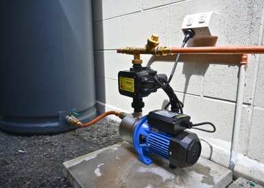 rains to mains pump installed in an outdoor setting